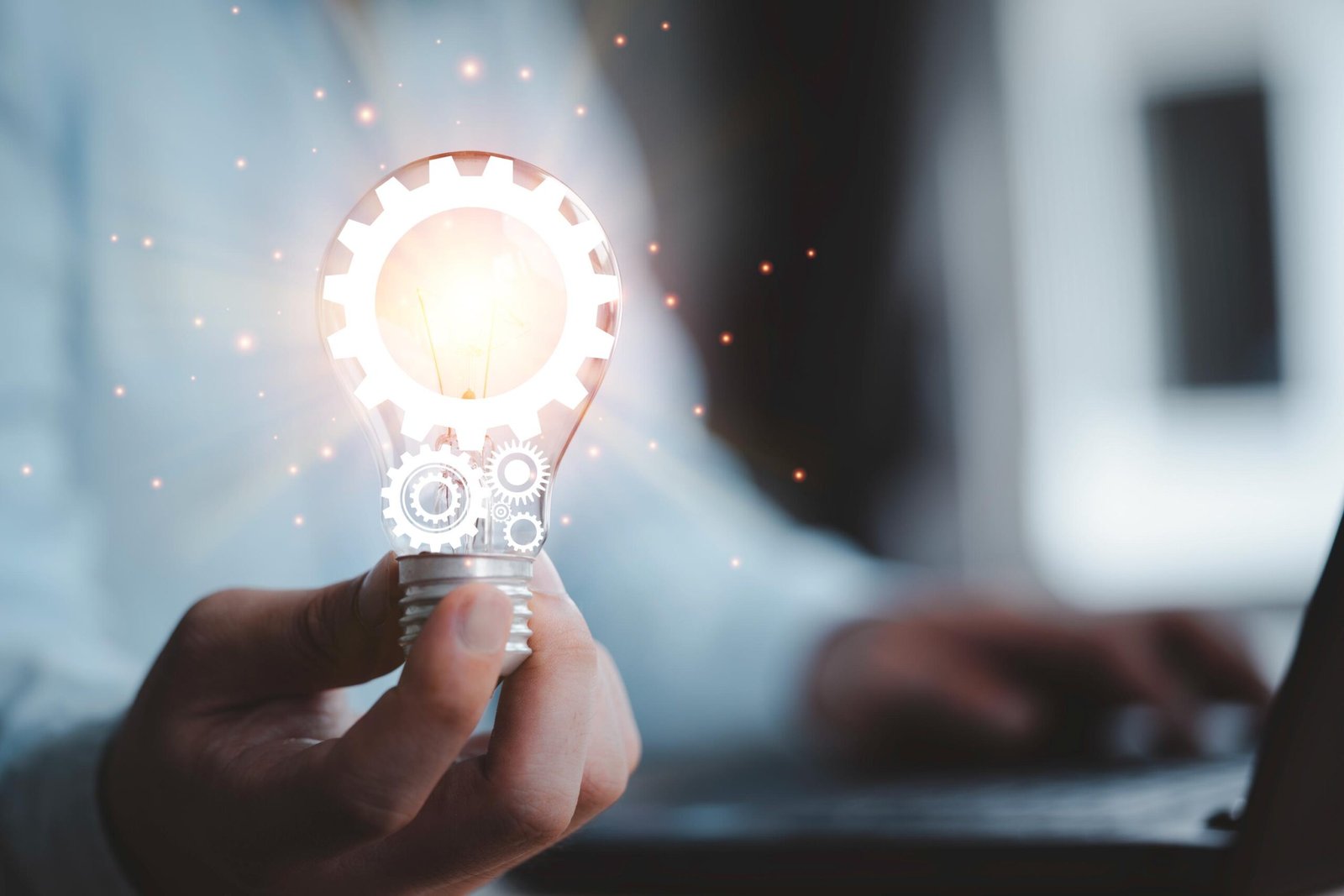 close-up-hand-holding-light-bulb